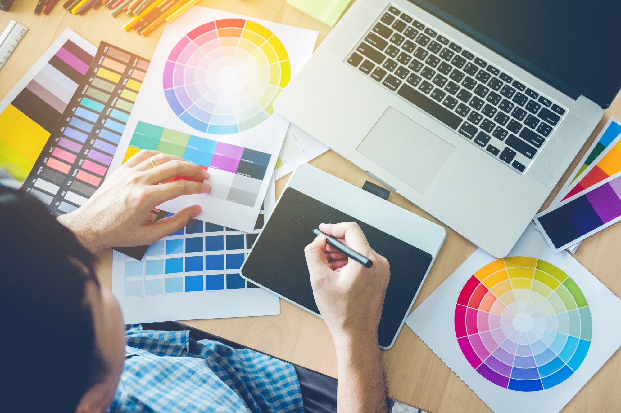 graphic designer at desk with computer